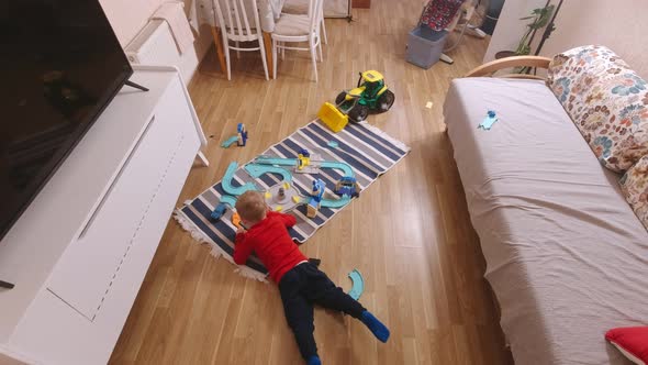 Boy With Tablet On The Floor