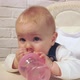 Baby Holding Bottle of Water in His Hands Looks at Camera and Smiles - VideoHive Item for Sale