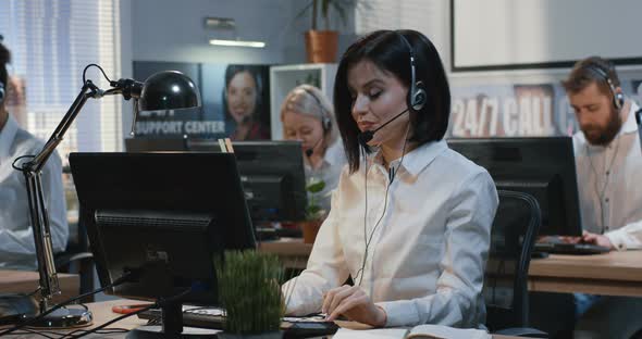 Young Woman Working at Her Desk