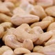 Cashew nuts rotating close up. Abstract background of organic ecological cashew nuts. - VideoHive Item for Sale