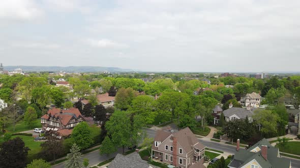 Bird view of historic residential neighborhood with immaculately landscaped properties.