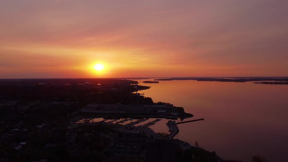 Aerial red sky sunset near city waterfront view