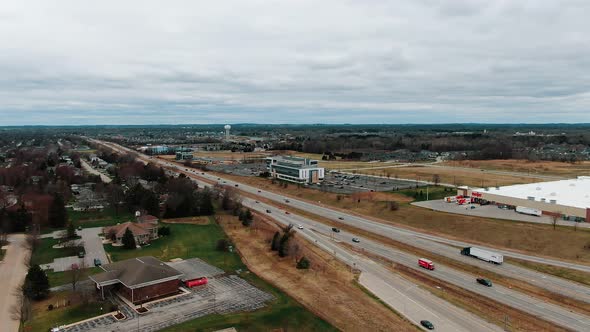 An aerial view of cars driving down a highway in Wisconsin during the springtime