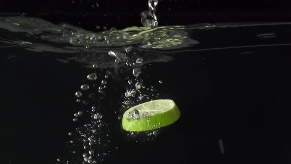 Parts of the Lime and Water Splash in Slowmotion