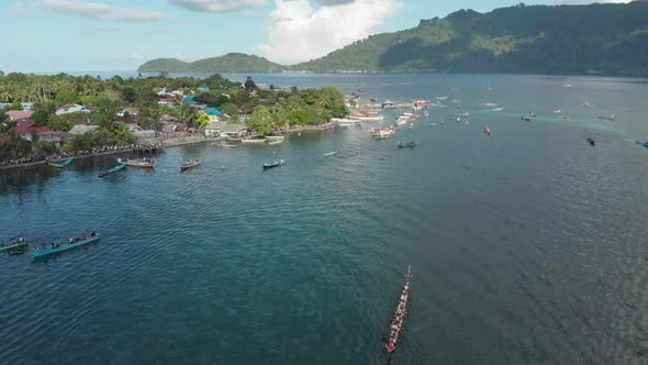 Aerial: kora-kora traditional canoe annual race in Bandaneira Indonesia