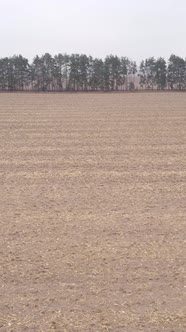 Vertical Video of a Field with Plowed Land in Autumn Slow Motion