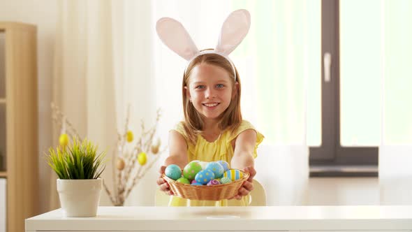 Happy Girl Showing Colored Easter Egg at Home 24