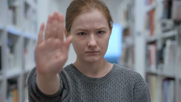 Stop Gesture by Young Woman in Office