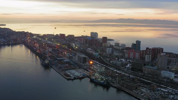Drone View of the Cargo Terminal with Port Cranes at Sunset