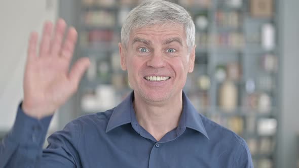 Portrait of Cheerful Middle Aged Man Showing Thumbs Up