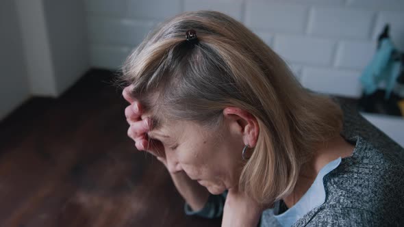 Desperate Lonely Elderly Woman Having a Headache