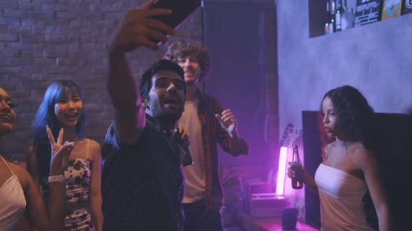 Young People Taking a Selfie Photo at Night Club