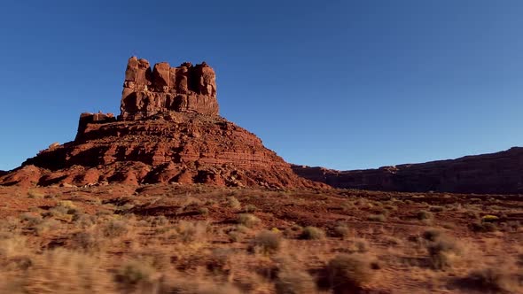 Driving past the rock formations of the Valley of the Gods