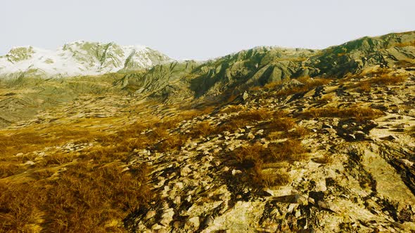 Beautiful Scenic Sunset View at Mountain Range and Dry Yellow Grass in Front