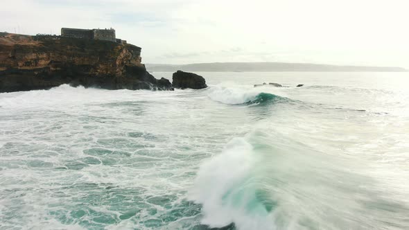 Viewing Point with Lighthouse on Cliff Near Ocean Aerial