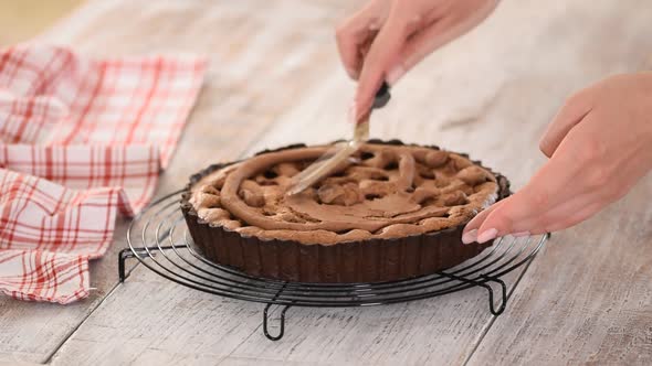 The Pastry Chef Makes Chocolate Almond Tart with Cream.