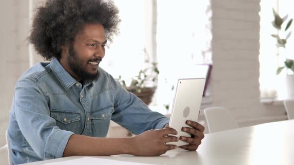 African Man Talking During Online Video Chat on Tablet