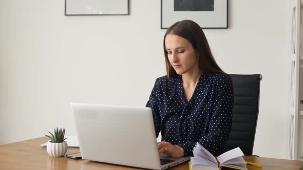 Smiling Female Manager Finishing Her Works