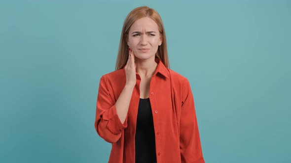 Young Woman Isolated on Turquoise Background Suffering From Severe Toothache.