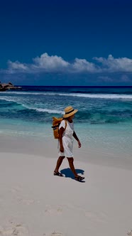 Anse Source d'Argent La Digue Seychelles Young Women on a Tropical Beach During a Luxury Vacation in