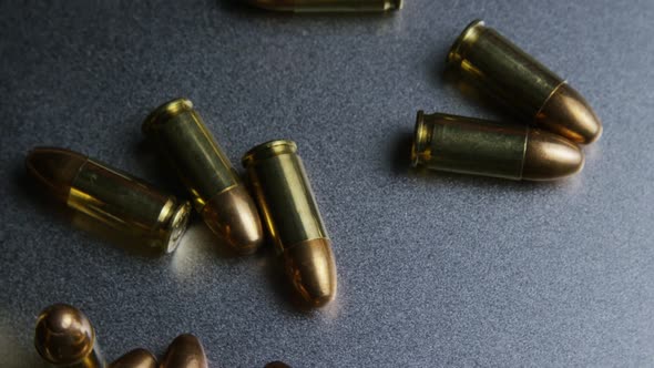 Cinematic rotating shot of bullets on a metallic surface - BULLETS 047