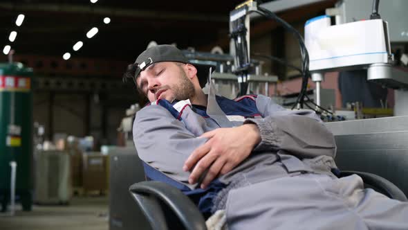 production technician sleeps near an assembly line, violating safety precautions