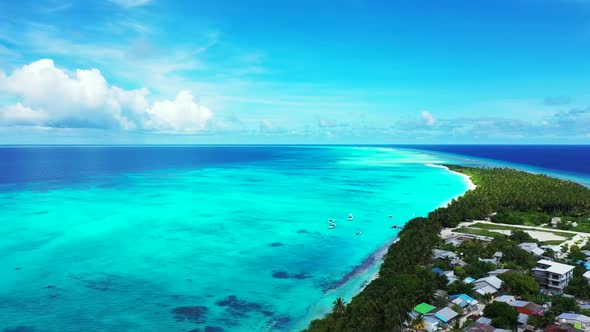 Aerial drone shot seascape of beautiful shore beach time by aqua blue lagoon with white sand backgro