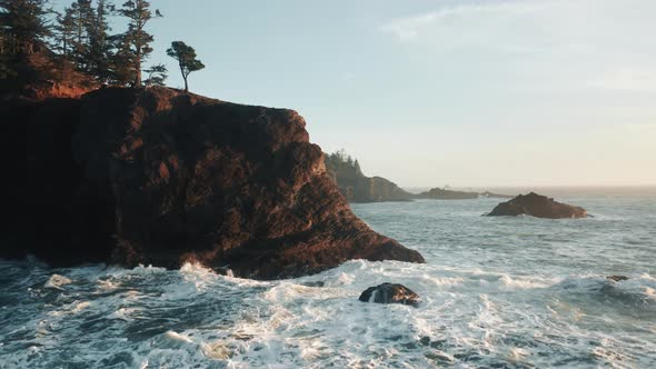 Aerial View of Ocean Waves Break on Rocks at Sunset Blue Sea Waves  Oregon