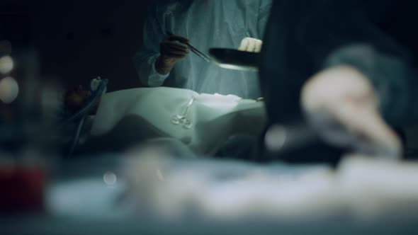 Closeup Surgeon Operating Hands in Ward