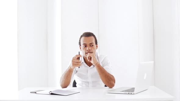 Young Businessman Thinking Smiling Showing Okay at Workplace Slow Motion