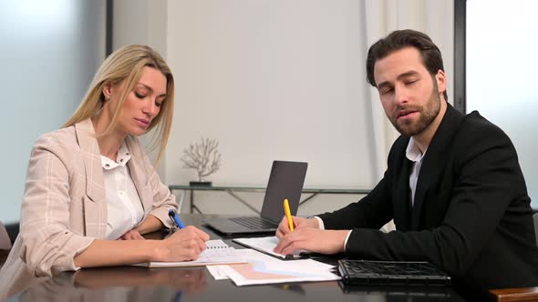 Young Modern Woman and Man in Smart Casual Wear Waving to the Camera