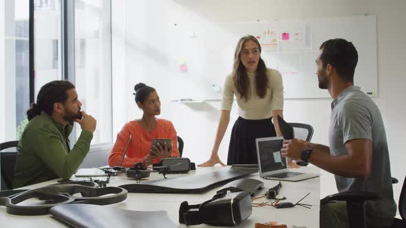 Diverse group of work colleagues brainstorming in meeting room