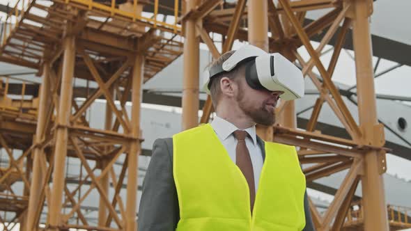 Construction Site Supervisor in VR Goggles