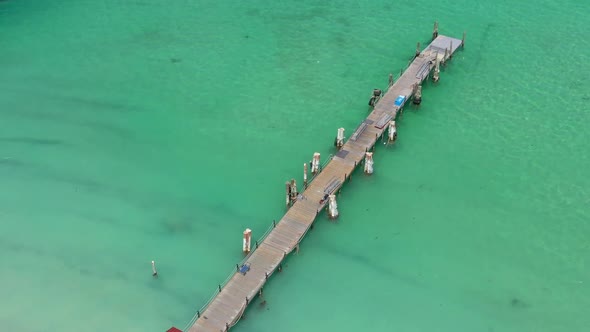 Aerial View From Drone on Caribbean Seashore with Wooden Pier