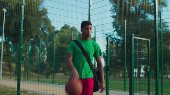 Streetball Player Going To Play Basketball on Court