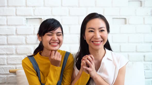 Excited Asian Females Watching TV