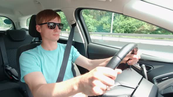 Man In Sunglasses Driving Car