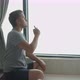 Man Smoking Electronic Cigarette Pipe By the Window at Home - VideoHive Item for Sale