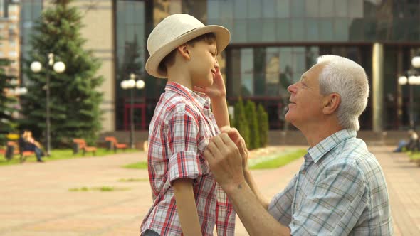 Senior Man Hugs His Grandson
