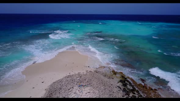 Aerial above texture of exotic shore beach holiday by blue sea and white sandy background of a dayou