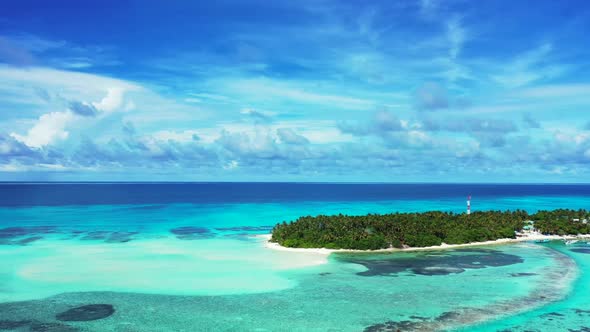 Aerial nature of perfect seashore beach break by transparent ocean and white sand background of adve