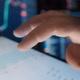 A Trader's Fingers Look at Stocks on the Market - VideoHive Item for Sale
