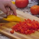 Dicing Yellow And Red Peppers On Kitchen Wood Cutting Board 01 - VideoHive Item for Sale