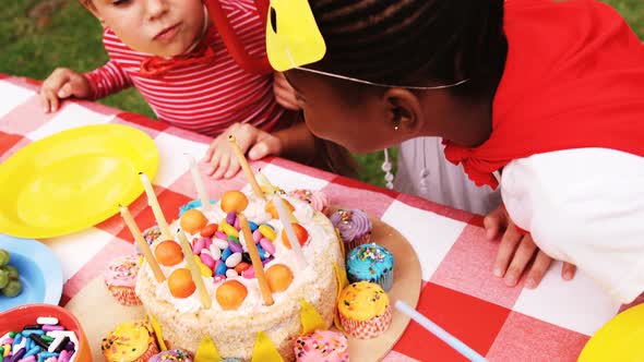 Kids in various costumes celebrating birthday