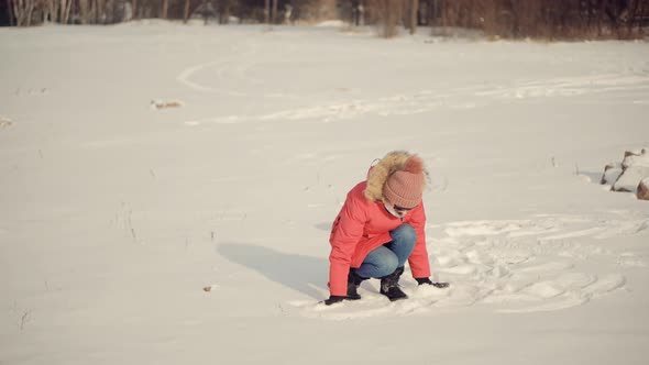 Woman Having Fun And Playing With Snow First Snow In Winter.Сheerful Woman Having Fun. Winter Fun.