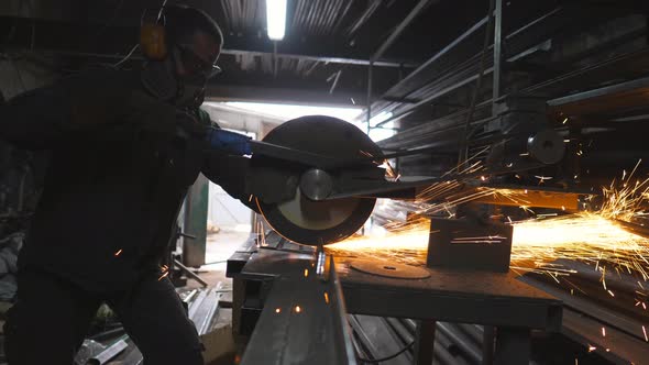 Man Use Saw Cutting Machine to Cut Metal Tube