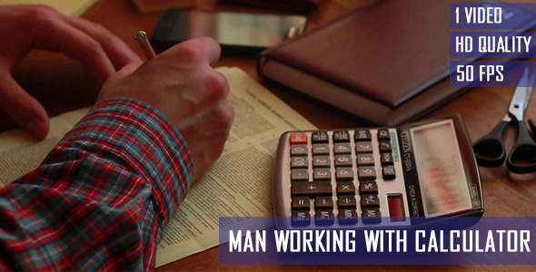 Man Working With Calculator