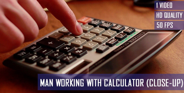Man Working With Calculator