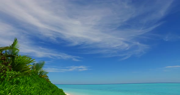 Tropical fly over abstract view of a white sandy paradise beach and blue ocean background in high re