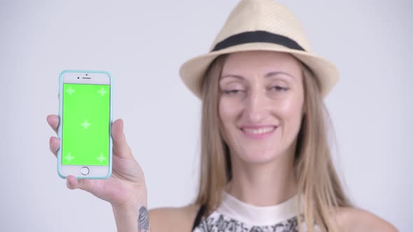 Face of Happy Blonde Tourist Woman Showing Phone